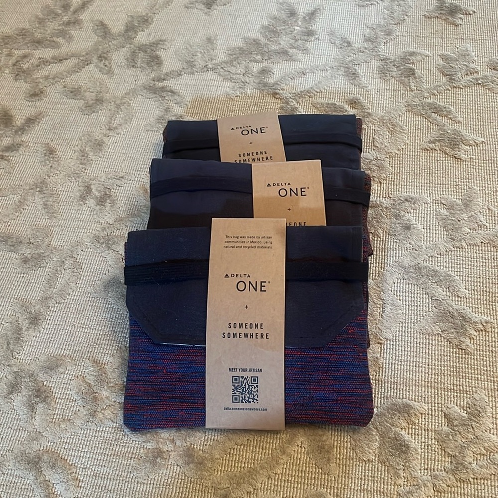 Delta One Someone Somewhere Amenity Kit. Artisan-Made. Red, blue, purple. NWT
